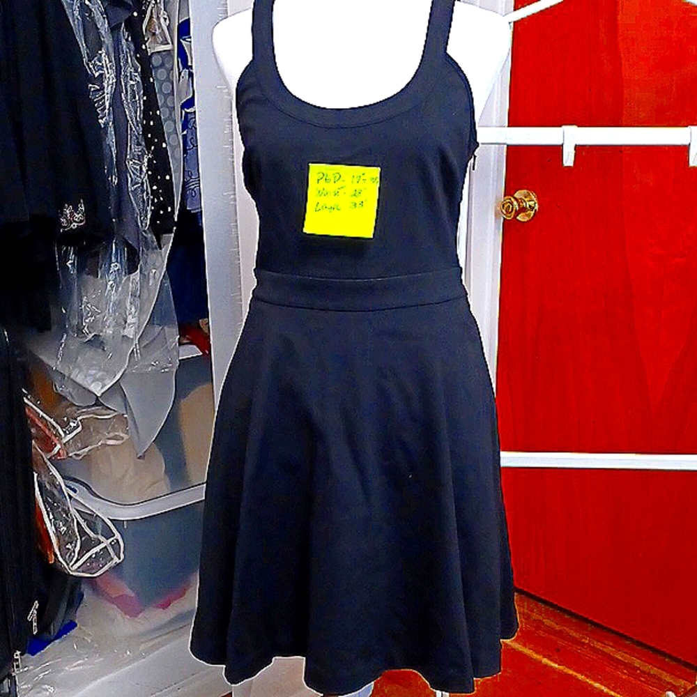 Black dress brand new with pockets. I no longer wear Petite 2 or 4.